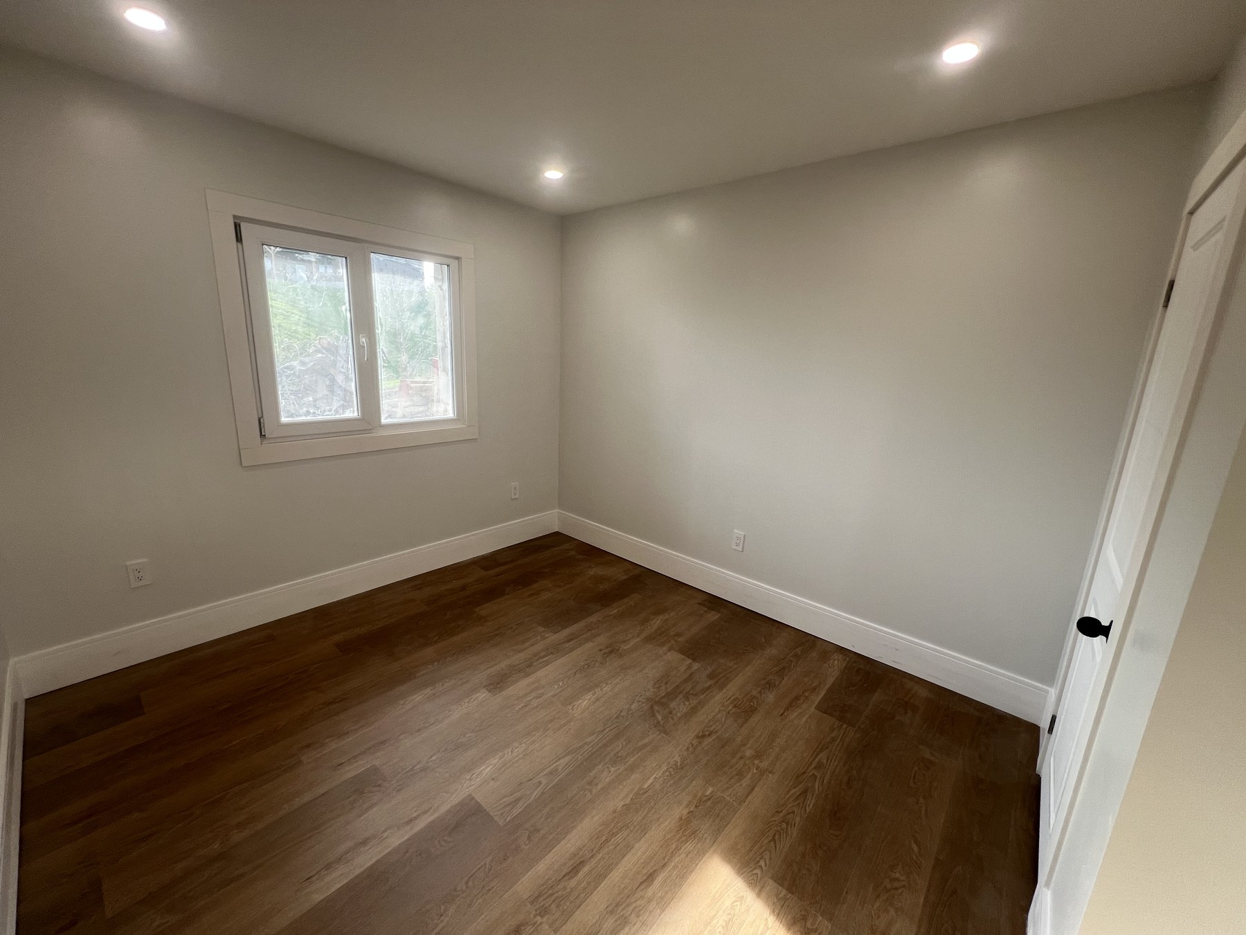 Spacious bedroom with European-style window