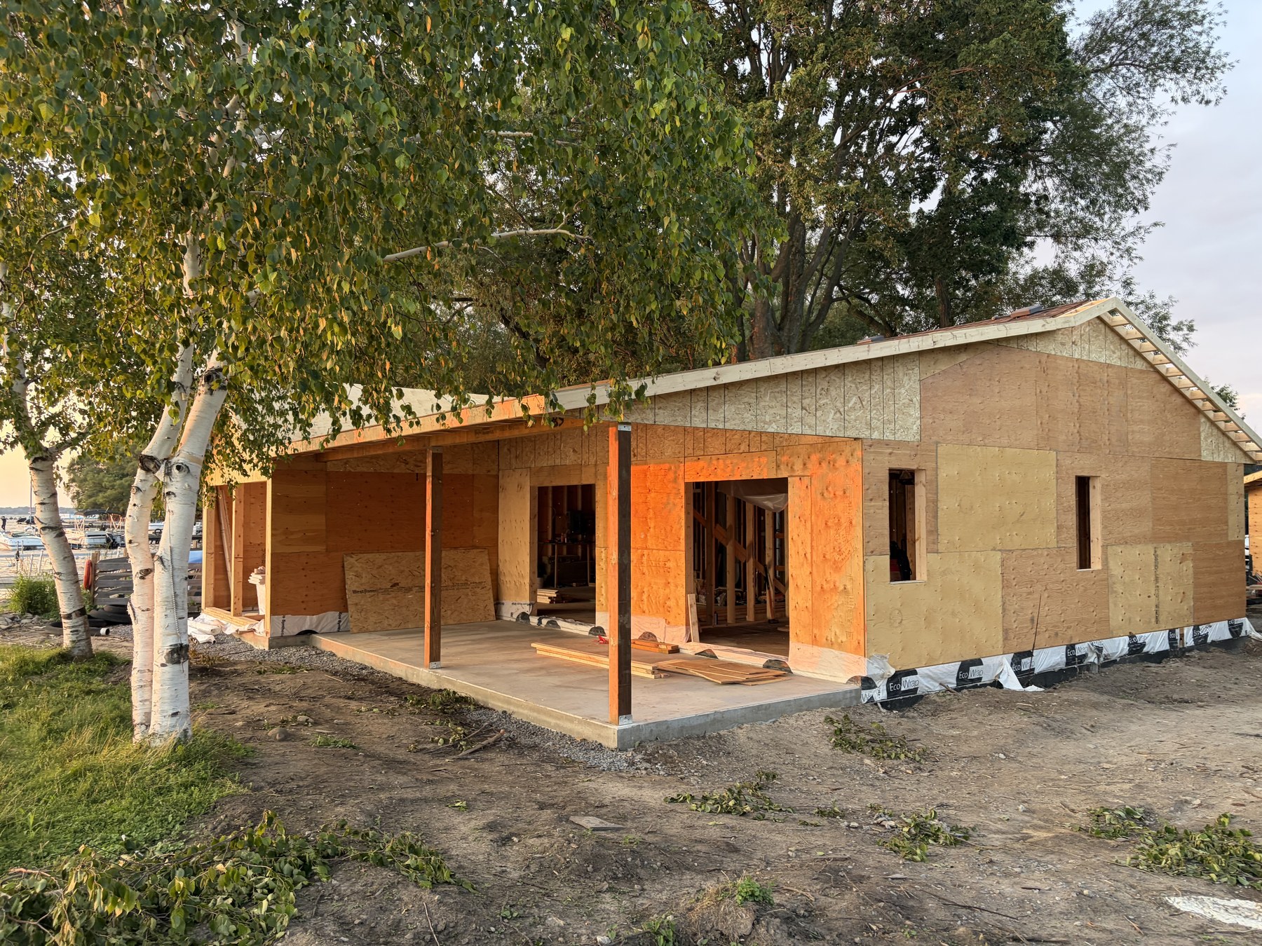 586 Lake Dr S - Structural framing and sheathing in progress at sunset