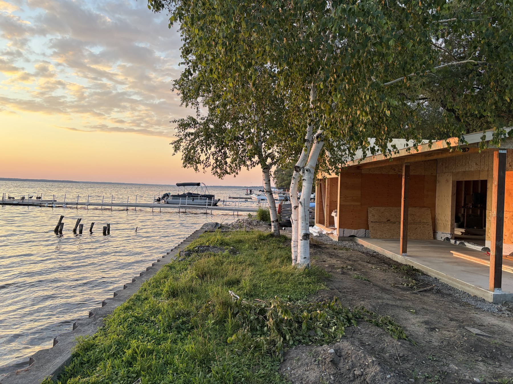 586 Lake Dr S - Roof extension over new poured concrete patio at the shoreline