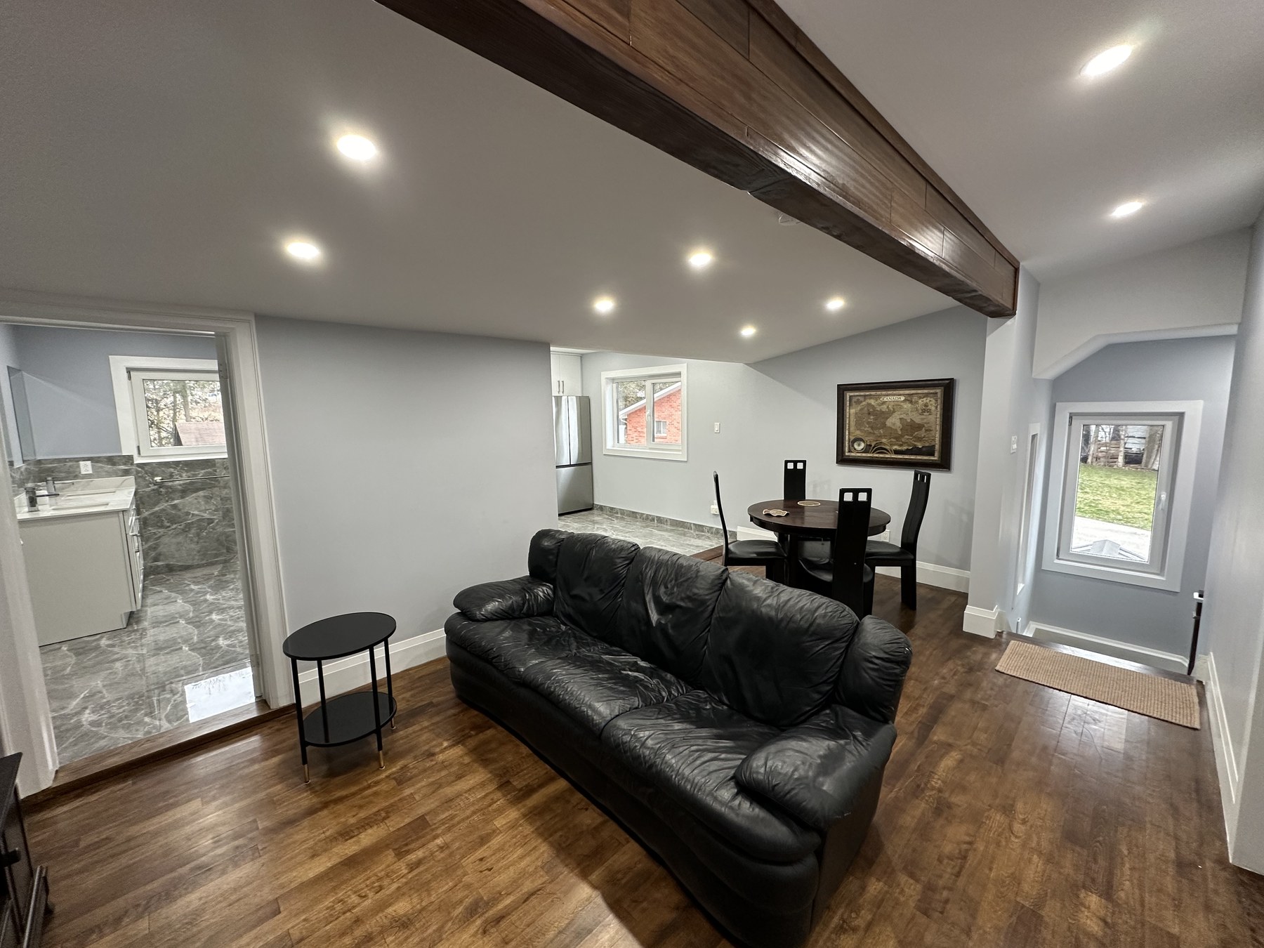 Open living and dining area with hardwood floors